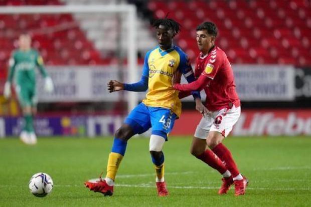 Southampton's Kgaogelo Chauke (left) and Charlton Athletic's Albie Morgan battle for the ball during the Papa John's Trophy, Southern Group G match at The Valley, London. Picture date: Tuesday October 5, 2021.