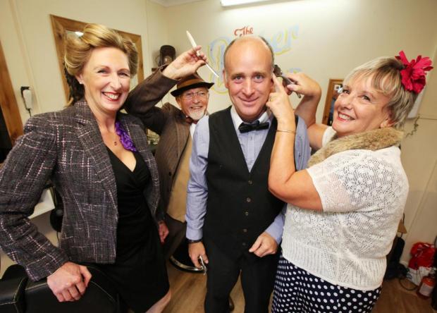 Daily Echo: Alison Campbell, Malcolm Hill, Barry Perrett and Julie Martin celebrate The Barber Shop's 70th anniversary in 2017.