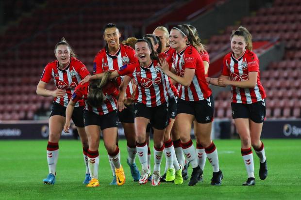 Daily Echo: Saints celebrate scoring against Portsmouth in their title-clinching match. Image by: Tom Mulholland