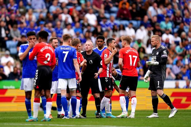 Players appeal to referee Jon Moss (centre) after a decision during the Premier League match at The King Power Stadium, Leicester. Picture date: Sunday May 22, 2022.