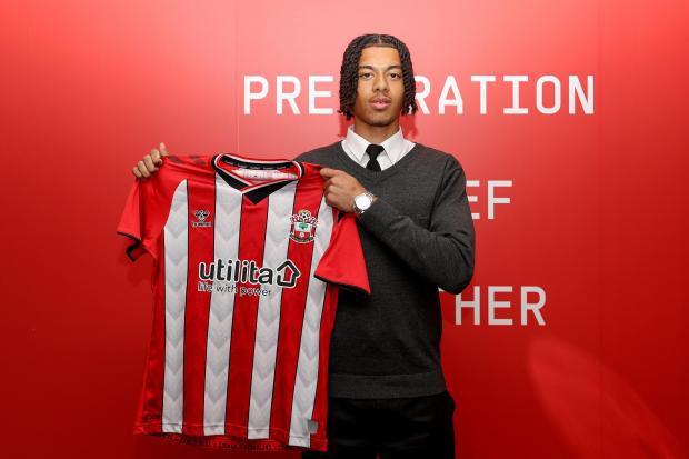 Iwumene holds his shirt up after signing for Saints. Image by: Southampton FC