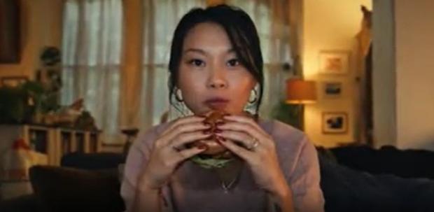 Daily Echo: A shot from the now banned Tesco advert of a woman eating a burger (Tesco/PA)