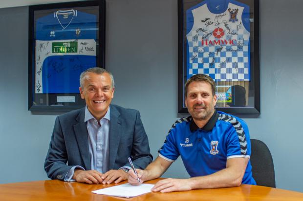 AFC Totton Chairman Stephen Snow (left) pictured alongside First Team Manger Jimmy Ball (right) after the latter signed a five-year deal (Pic: Craig Hobbs Photography)