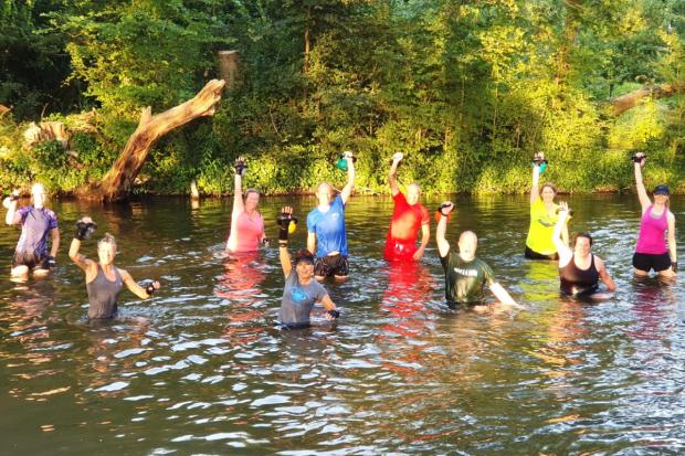 Daily Echo: Penni Harrison (front centre) previously held kettlebell classes in the River Itchen once a year, on very hot days