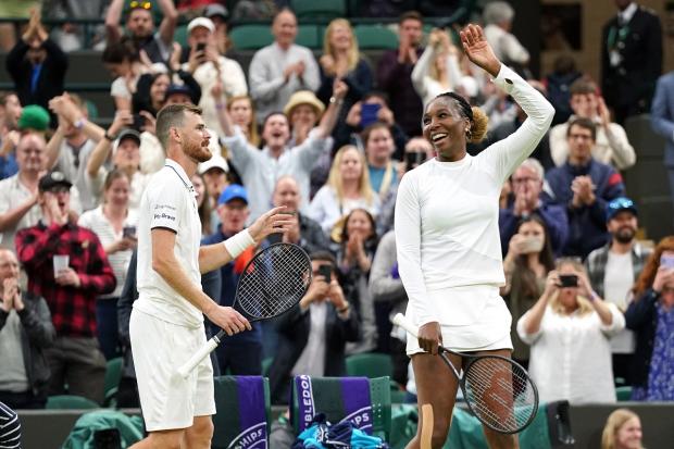 Jamie Murray and Venus Williams celebrate victory in their mixed doubles Wimbledon match against Alicja Rosolska and Michael Venus. Picture: PA