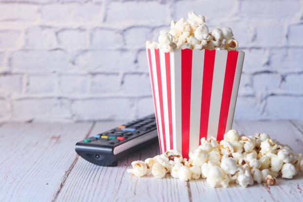 Daily Echo: A box of popcorn and a TV remote (Canva)