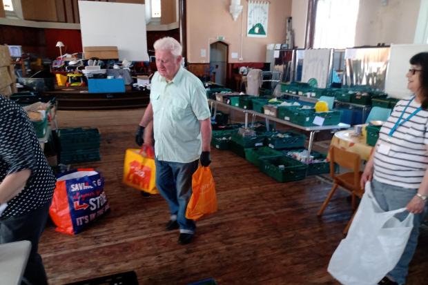 Volunteers work to feed Sotonians at Southampton City Missions' Basics Bank.