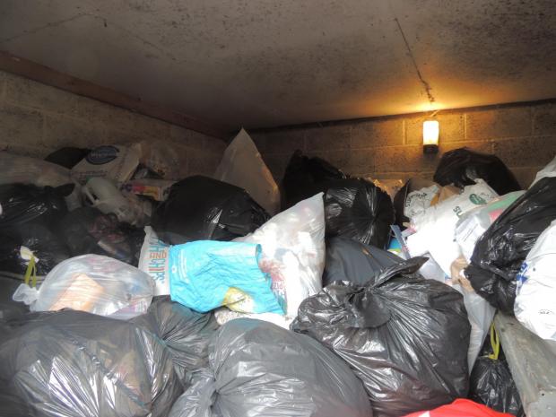 Daily Echo: The overflowing bin store at the block of flats on Shirley Road, Southampton