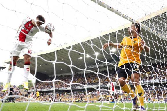 Daily Echo: Che Adams handles the ball over the line at Wolves. Daily Echo: Che Adams handles the ball over the line at Wolves.