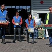SOUTHAMPTON, ENGLAND - APRIL 06: Former Southampton FC player and current club ambassador Matt Le Tissier(R) volunteers along with Saints foundation staff, at local food distribution centre FareShare, on April 06, 2020 in Southampton, England. (Photo by