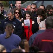 Hundreds mourn firefighters at open air service