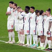 England's Jadon Sancho (17) and Bukayo Saka alongside team mates during the penalty shoot out following the UEFA Euro 2020