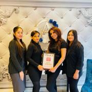 The team at Ange's Brow & Waxing, with Amarjeet holding the winner's certificate