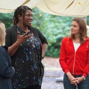 Culture Secretary Lucy Frazer (right) speaking to the CEO of UK Youth Ndidi Okezie (middle)