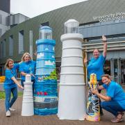 Trail lighthouses, designed by Jess Perrin and Kezia Hoffman, with hospital staff