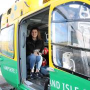 Steph Blake aboard an air ambulance she will help fund
