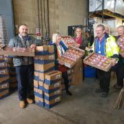 Volunteers from The Big Difference with food to donate