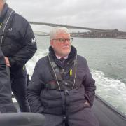 Maritime Minister, Lord Davies, on a boat ride in Ocean Village