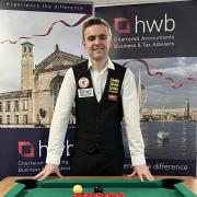 Budding international snooker star Steven Hughes, an Audit & Accounts Senior at HWB Chartered Accountants, is pictured at the pool table in the firm’s office in Chandler’s Ford