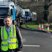 Geoff Cooper in front of Southern Water tankers in Romsey.