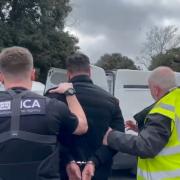 A man suspected of being a significant figure in a Kurdish organised crime group involved in smuggling people to the UK in boats and HGVs has been arrested by the National Crime Agency.