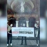 Protestors were seen outside a Southampton church holding a banner and smoke grenades
