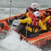 Members of Calshot RNLI showcase their new lifeboat, David Radcliffe, after its official naming ceremony