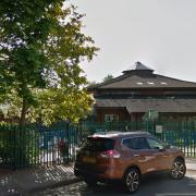 A man has been arrested on suspicion of arson after a large fire at Manor Infant School in Portsmouth