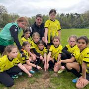 Marcus Kennedy with the under nine girls' football team