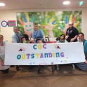 The care and catering team at Naomi House & Jacksplace, with children who visit the hospices