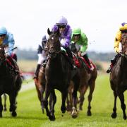 Comanche Brave (centre) winning at the Curragh (Evan Treacy/PA)