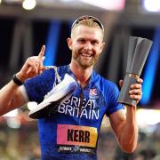 Josh Kerr celebrates after winning the men’s 1500m final (Martin Rickett/PA)