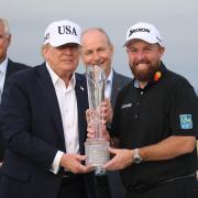 US President Donald Trump presented the trophy to Shane Lowry (Liam McBurney/PA)