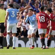 Phil Foden reacts after being shown a red card (Peter Byrne/PA)