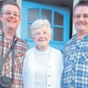 DEVOTED: Margaret Tobutt, 72, with her twin sons, Allan, left, and Mark, right, at home in Southampton.