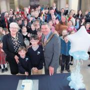 William and Henry Ward cut the birthday cake with mayor and mayoress Cllr Derek and Christine Burke.