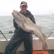 Kim catches heavy cod