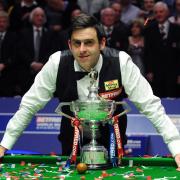 England's Ronnie O'Sullivan celebrates his victory with the trophy after the final during the Final of the Betfred.com World Snooker Championships at the Crucible Theatre, Sheffield. PRESS ASSOCIATION Photo. Picture date: Monday May 7, 2012. See