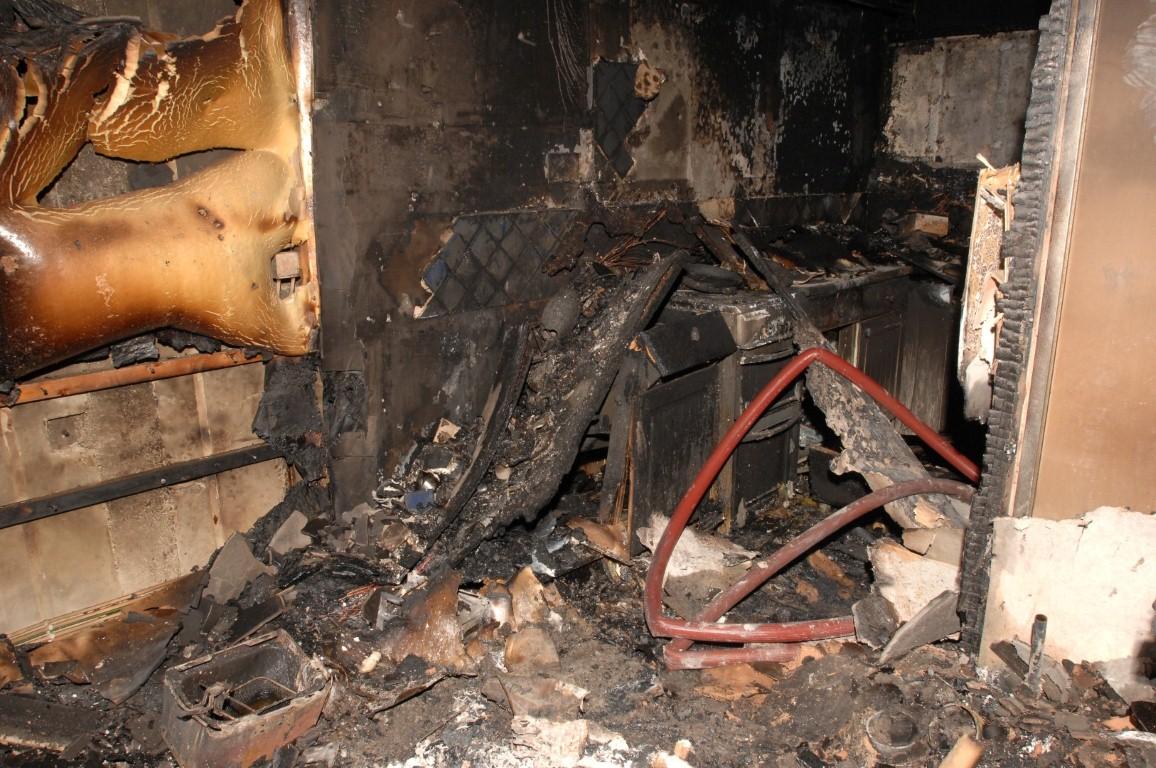 The kitchen of flat 72, with the remains of a cooker and scorched units, where the temperature reached up to 1000 degrees centigrade.