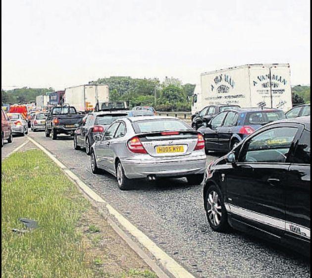 Delays for motorists as car fire shuts major road