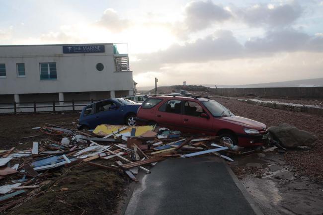Diners rescue as from restaurant battered by stones from beach blown by 80 mile and hour winds