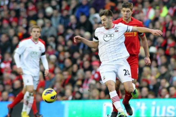 Adam Lallana challenges new team-mate Steven Gerrard during Liverpool's 1-0 win over Saints in 2012.