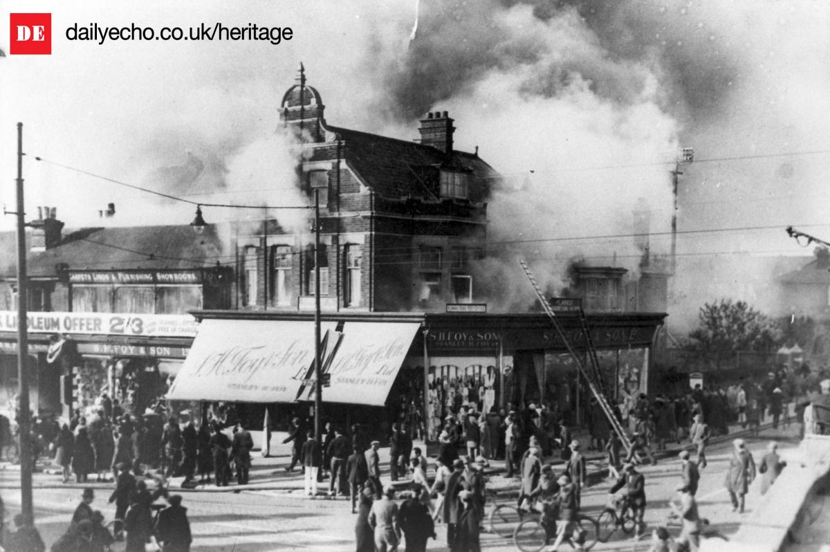 Crowds gather outside the business premises of S.H.Foys as fire rips through their shop on Foy’s Corner