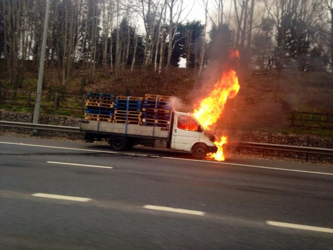 Firefighters tackle vehicle fire on motorway