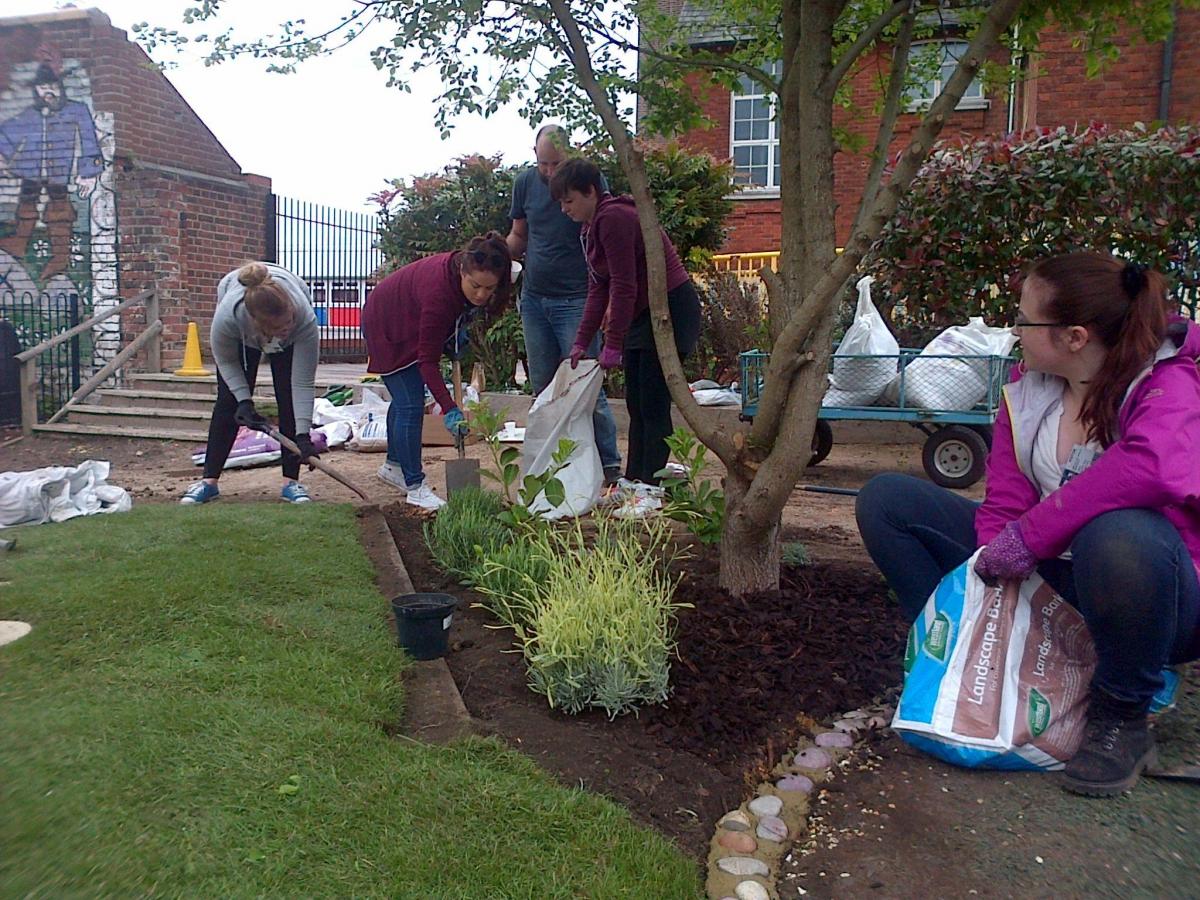 Matchtech employees working in garden at St Marks Primary School.