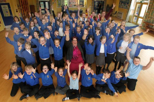 Wildground pupils and staff including headteacher Amanda Mullett celebrate the school's 'Good' Ofsted report