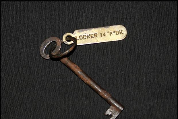 A small, corroded key for a locker on the Titanic has sold for £85,000 at auction.