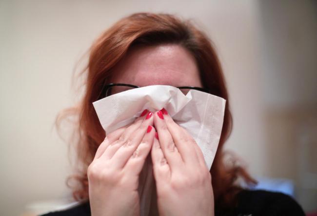 File photo dated 18/01/18 of a woman with a tissue. The Met Office warned that pollen levels have been unusually high in recent weeks and are set to be high on Sunday and Monday, with England worst hit, particularly London, the South East, the East of Eng