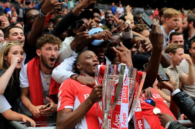 Daily Echo: Aribo hoists the 2019 League One playoff final trophy. Image by: PA